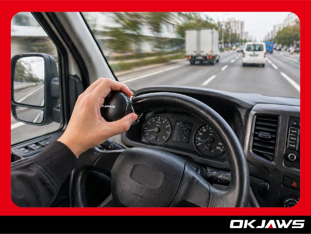 commercial vehicle driver using steering wheel spinner knob for improved control and comfort