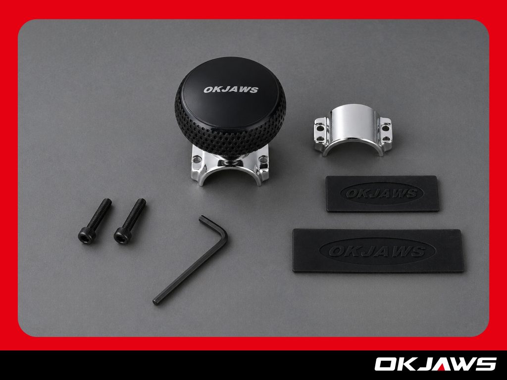 Installing a steering wheel knob on a car steering wheel with rubber protection pad and screws